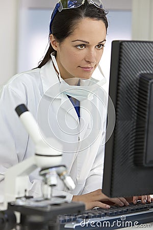 Female Scientist Doctor & Computer In Laboratory