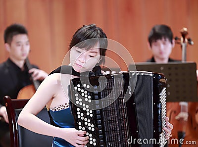Female student playing accordion