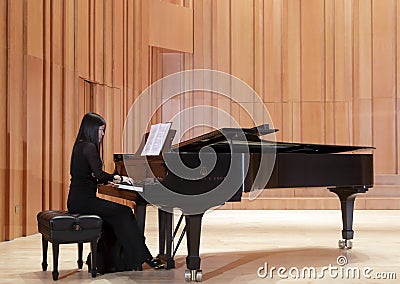 Female teacher playing piano