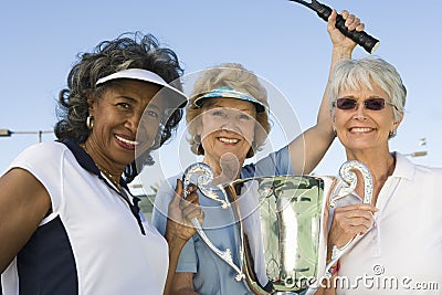 Female Tennis Players Holding Trophy