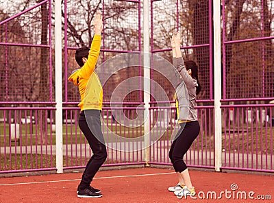 Female trainer with man exercising