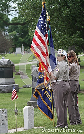 Female Veterans in uniform with American Flag