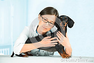 Female veterinarian with dog