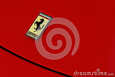 Ferrari logo on red sport car