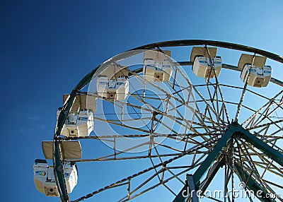 Ferris wheel against blue sky.