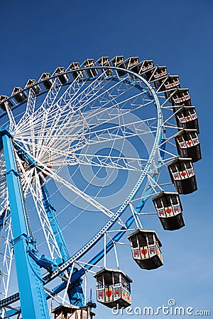 Ferris wheel against clear blue sky