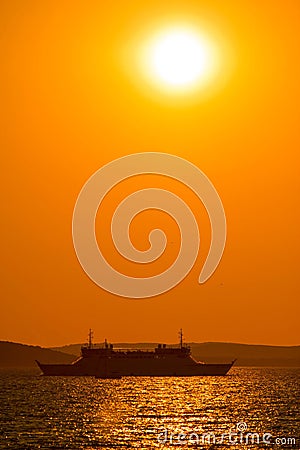 Ferry boat under sun vertical view