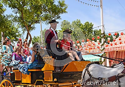 Festive-goers on horse carriage during Seville Spring Festival 201