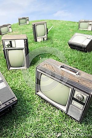 Field of grass with retro tv s