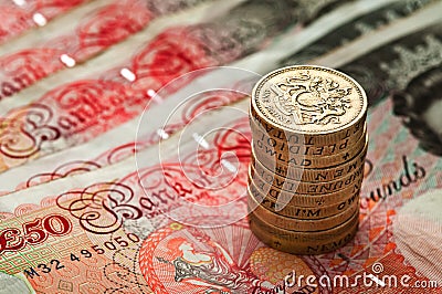 Fifty pounds sterling an coin stack - UK Currency