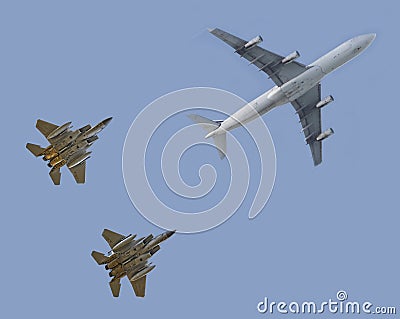 Fighter jets escorting passenger airplane