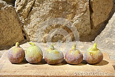 Figs on a wooden board.