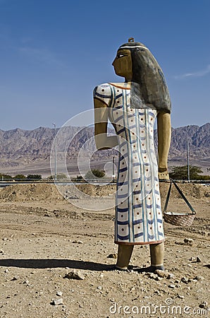 Figure of ancient Egyptian woman in desert, Israel