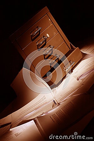 Filling cabinet with documents all over the floor