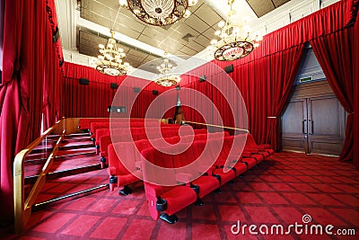 Film theatre with chandeliers and rows of seats