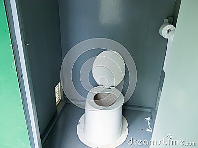 Filthy camp ground outhouse latrine inside toilet