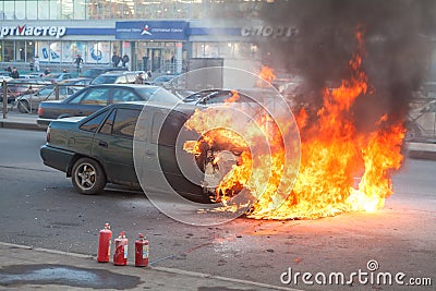 Fire from the car engine hood on city street