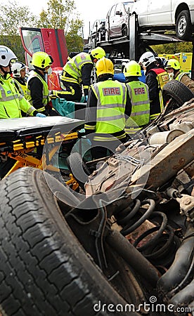 Fire service and ambulance crews at a car crash