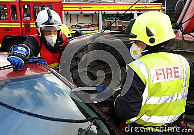 Fire service jaws of life cutting at a car crash