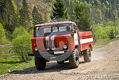 Fire truck driving on country road