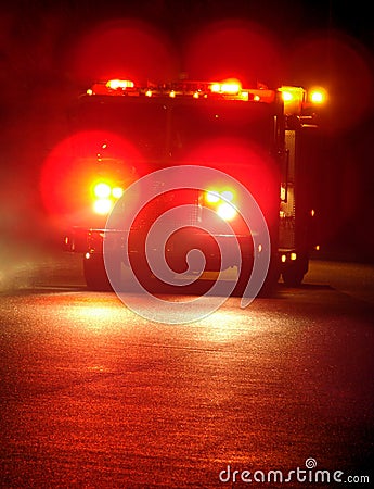Fire Truck with Emergency Lights Driving at Night