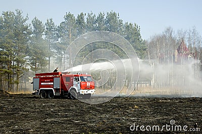 The fire truck extinguishes a fire