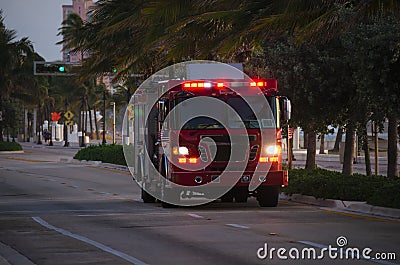 Fire truck with flashing emergency lights at dusk