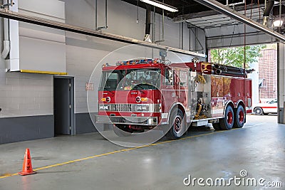 Fire Truck Parked inside Firefighter Station