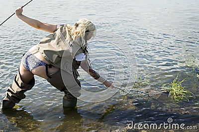 Fisher woman catching fish