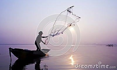 Fishermen are catching fish with a cast net.