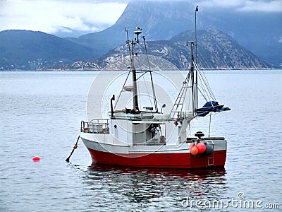 Fishing boat on anchor in haven