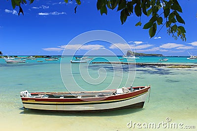 Fishing boats, turquoise sea and tropical blue sky