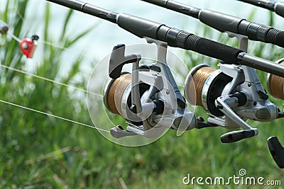 Fishing reel on the river bank