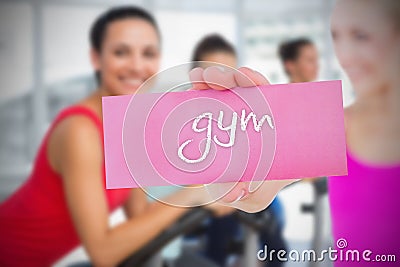 Fit blonde holding card saying gym