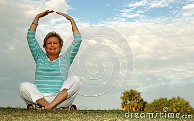 Fit senior woman meditation/praise