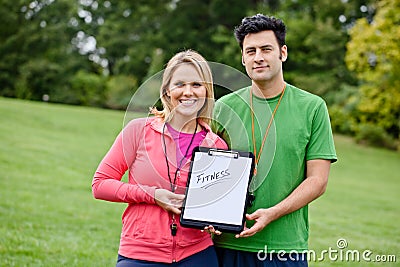 Fitness coaches with clipboard