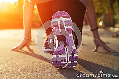 Fitness Girl running at sunset