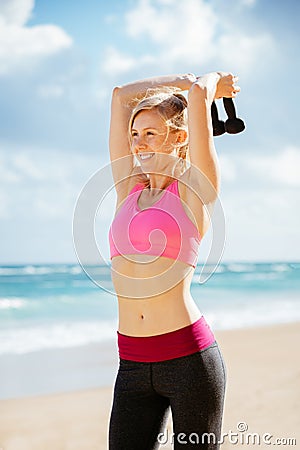 Fitness woman with barbells working out