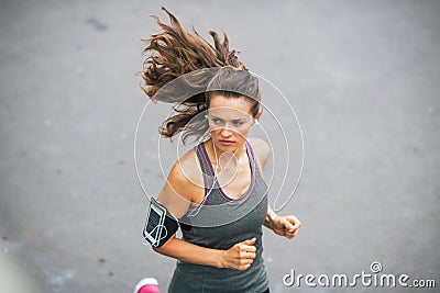 Fitness young woman jogging outdoors in the city