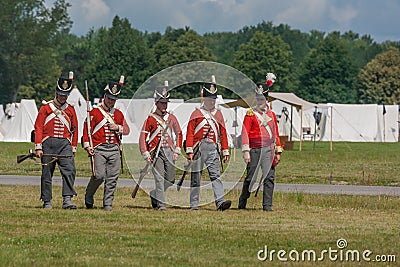 Five Men Walking in Uniform