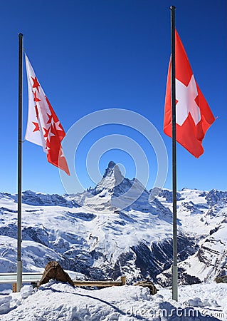 Flag of Switzerland on mountaintop