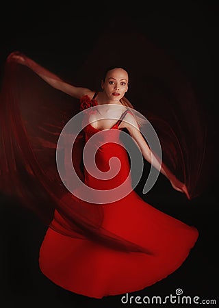 Flamenco dancer in red dress with veil