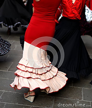 Flamenco dancers expert and dance with elegant period costumes