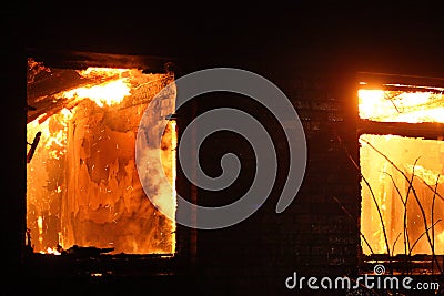 Flames inside house on fire.