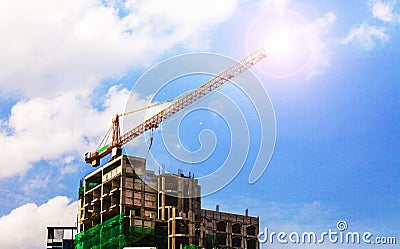 Flare lighting Construction site with cranes on sky background