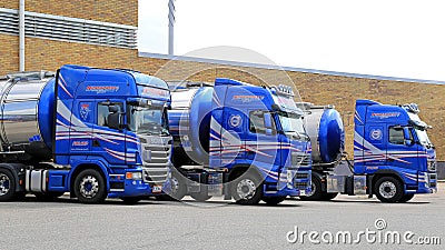 Fleet of Blue Tanker Trucks on a Yard