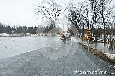 Flood waters over roadway following heavy rains