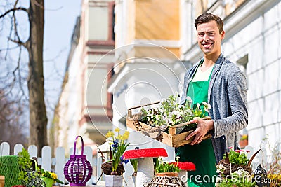 Florist with plant supply at shop