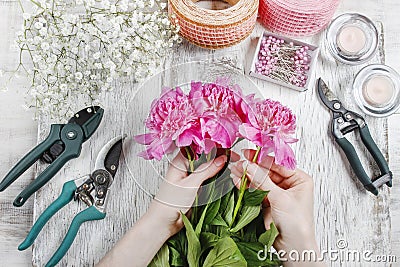 Florist at work. Woman making spring floral decorations