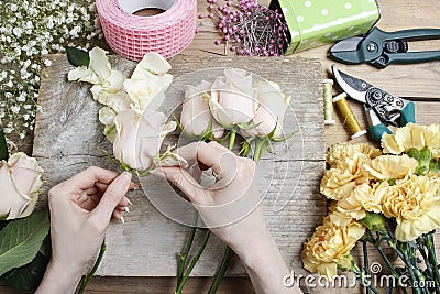 Florist at work. Woman making wedding bouquet